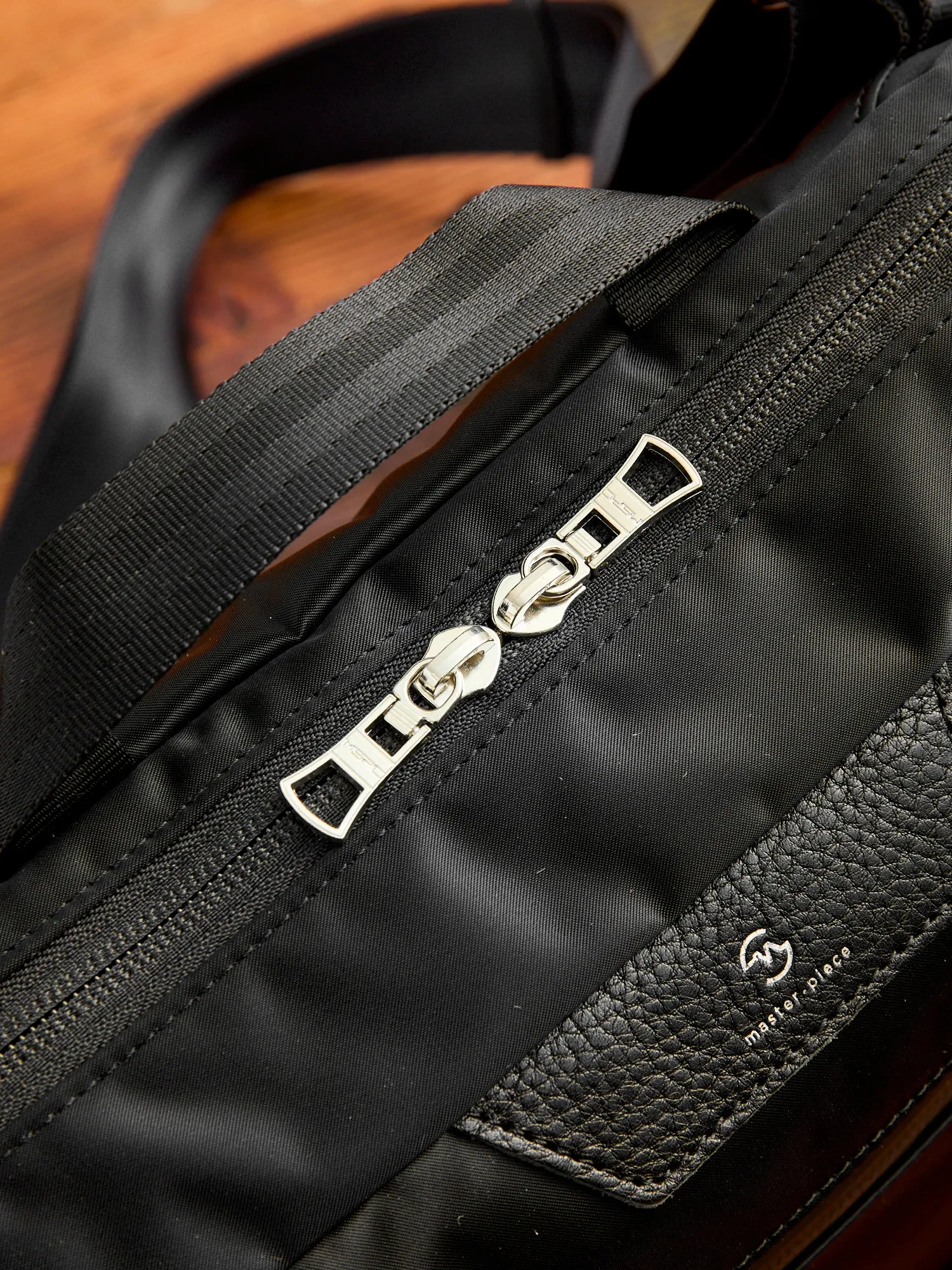 Progress Shoulder Carry Bag in Black