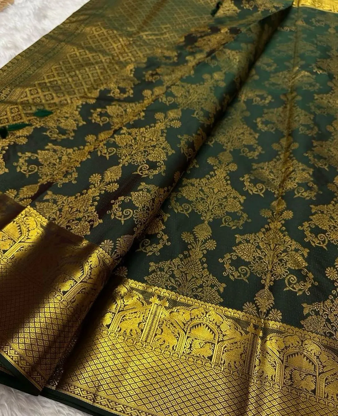 Rhapsody Dark Green Soft Banarasi Silk Saree With Stunning Blouse Piece